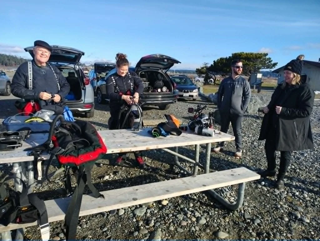 Divers gearing up at the picnic tables at Keystone Jetty in Fort Casey State Park, Whidbey Island.